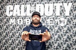 1UP Sports Marketing client Julian Edelman holding a mobile phone at the Call Of Duty: Mobile launch event