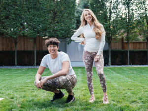 1UP Sports Marketing clients Brittany Lynne Matthews and [brother of Patrick Mahomes] Jackson Mahomes standing in a grassy lawn