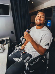 1UP Sports Marketing client Bradley Chubb with a Snickers bar in his mouth - vertical